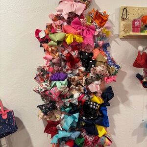 A Lot of over 50 bows. Variety of colors, bows for every holiday, church, party